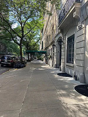 Urban office building with surrounding sidewalk and street